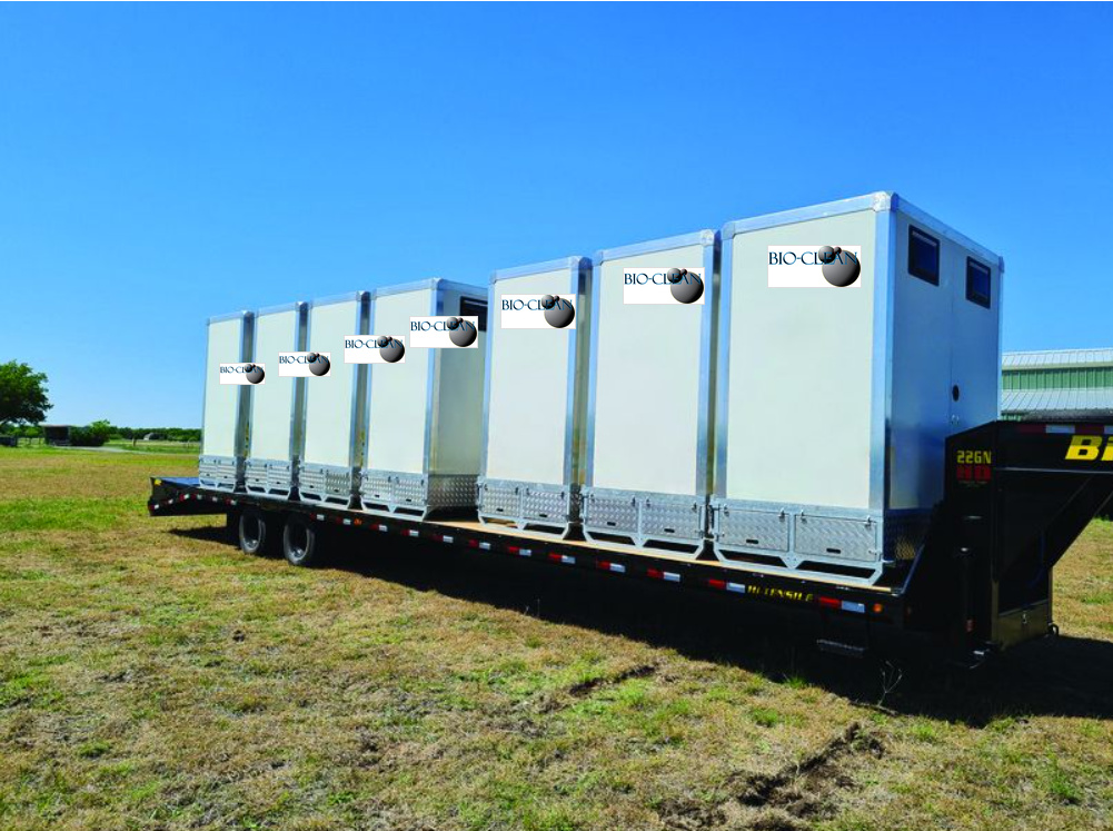 ECOLOO restroom units loaded on a flatbed trailer for delivery