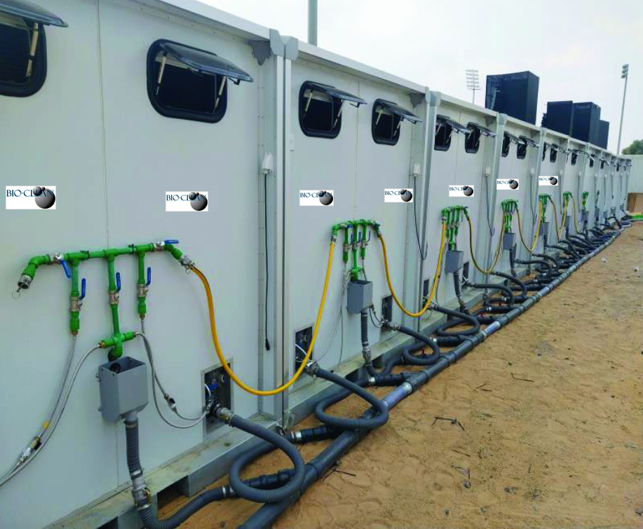 The rear of ECOLOO restroom units showing water and waste hookups